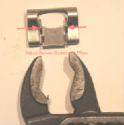 picture of adjusting a spread  wings of a blade socket with pliers